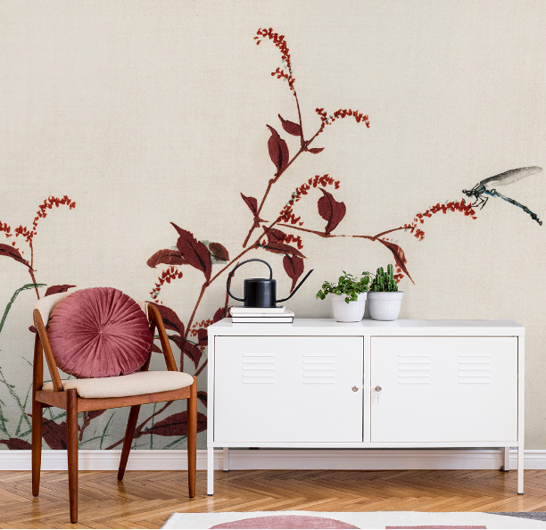 white and ruby red dragonfly wallpaper in lounge with white cabinet and chair with red cushion