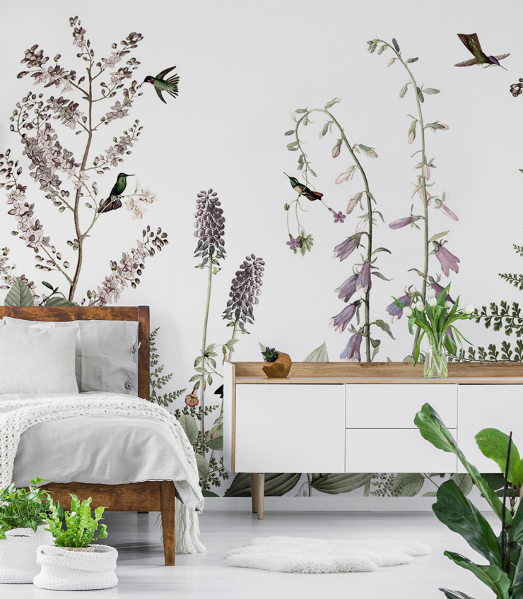 white background pale lilac and green foliage and hummingbirds illustrated wallpaper in white bedroom