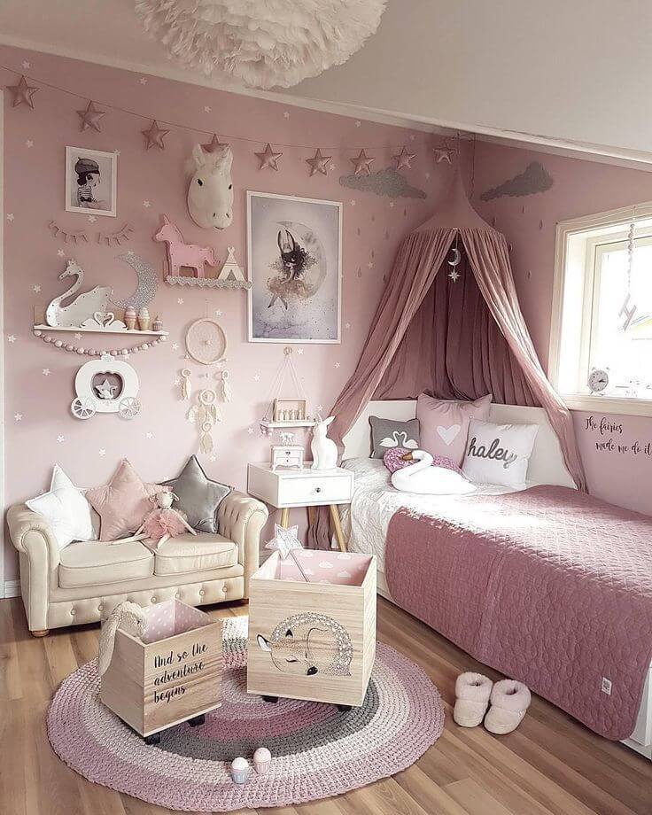 pale pink princess/unicorn child's bedroom with bed canopy