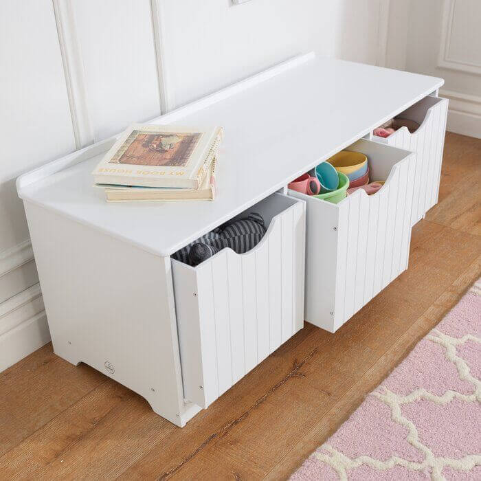 white toy storage bench in living room