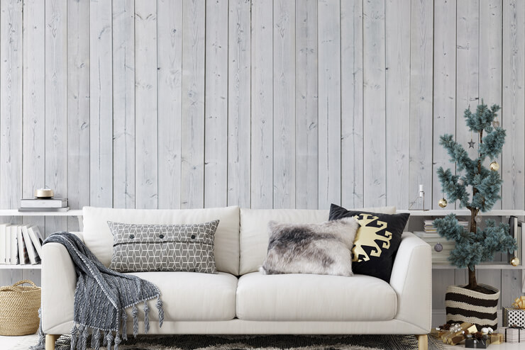faux white wooden wall wallpaper in cozy living room following christmas decor trends