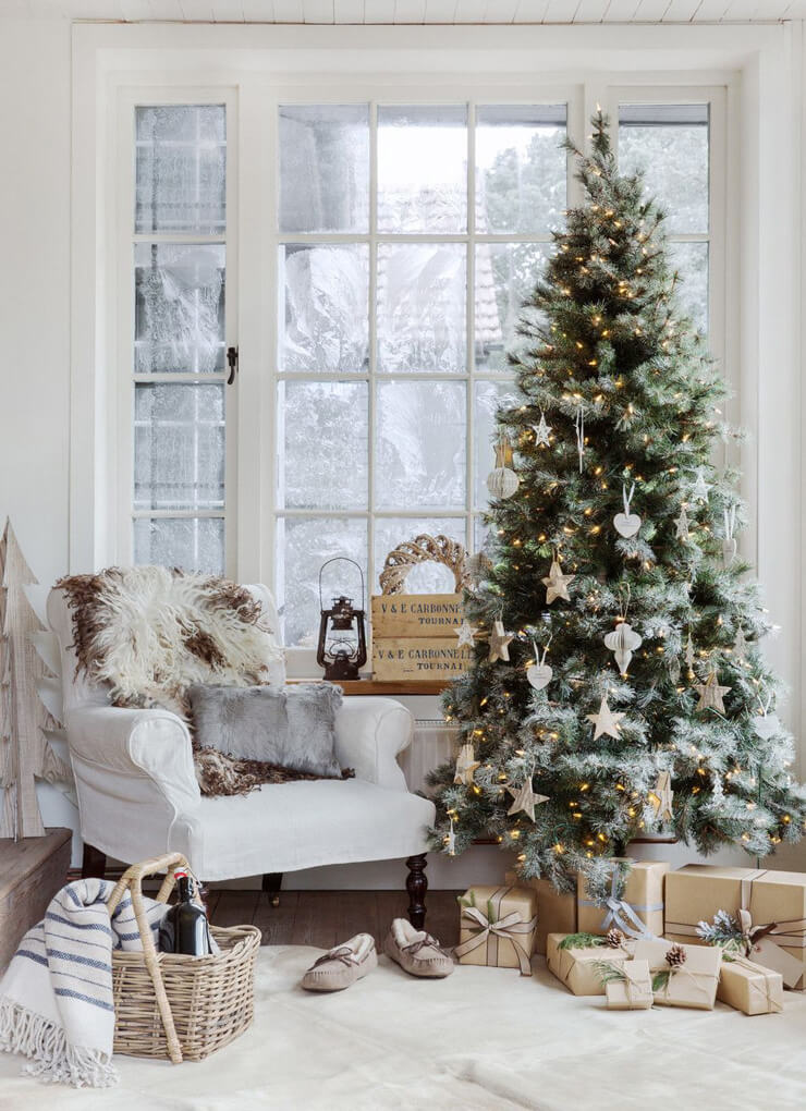 White and beige living room with a neutral Christmas tree and neutral decorations