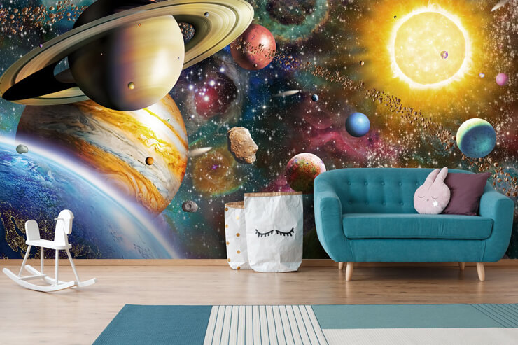 Planet and space wallpaper in living room with a teal sofa and purple accessories