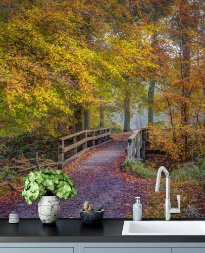 mural de bosque naranja, verde y marrón llamado Bridge in Autumn Forest de Assaf Frank