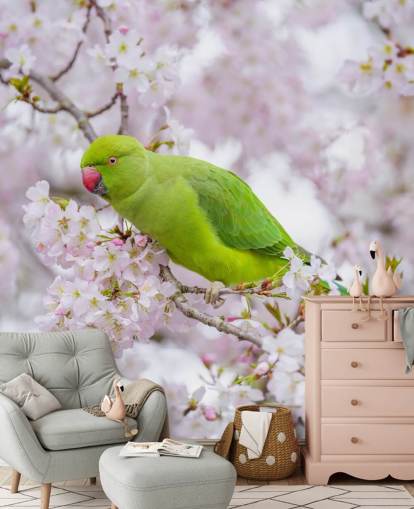 murale con fiori di ciliegio rosa e verde chiamato Parrot Sitting in a Blossom Tree di Assaf Frank