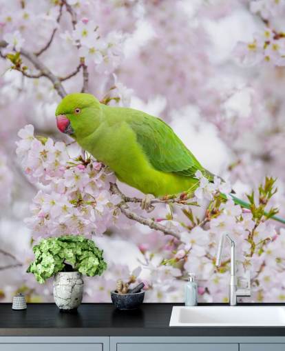 pink and green cherry blossom mural called Parrot Sitting in a Blossom Tree by Assaf Frank