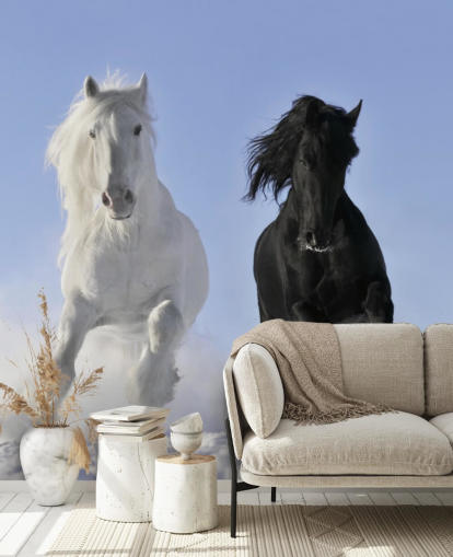 Mural Caballo blanco y negro saltando sobre una colina nevada