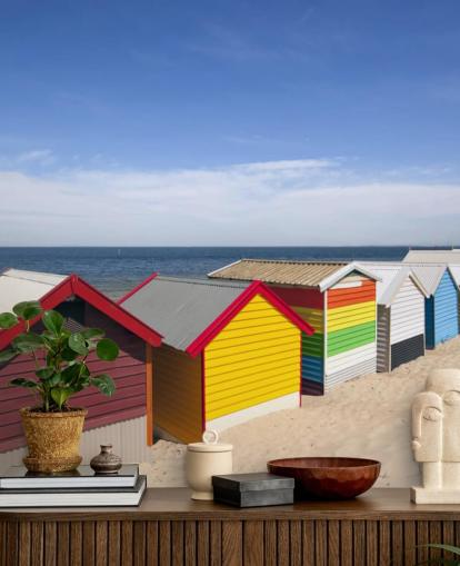 colourful beach huts on beach wallpaper