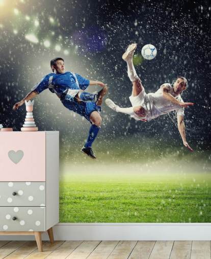 mural de papel pintado de fútbol personalizable azul, verde y blanco llamado Two Football Players Striking the Ball para dormitorio infantil