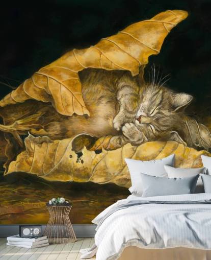 kitten asleep in autumn leaves