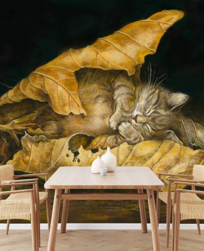 gattino addormentato in foglie autunnali