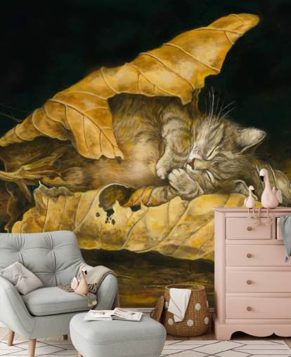 kitten asleep in autumn leaves