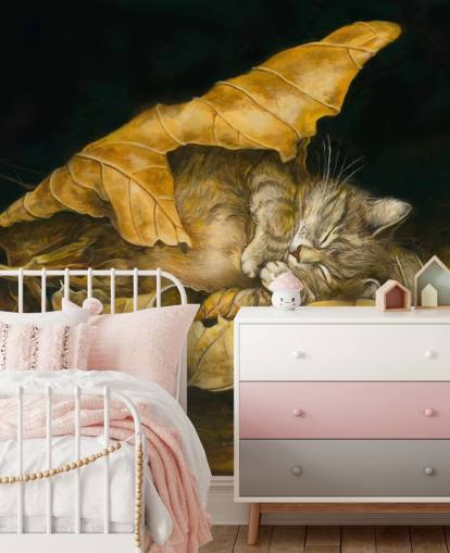 gatito dormido en hojas de otoño