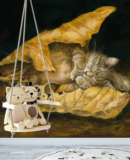 gatito dormido en hojas de otoño