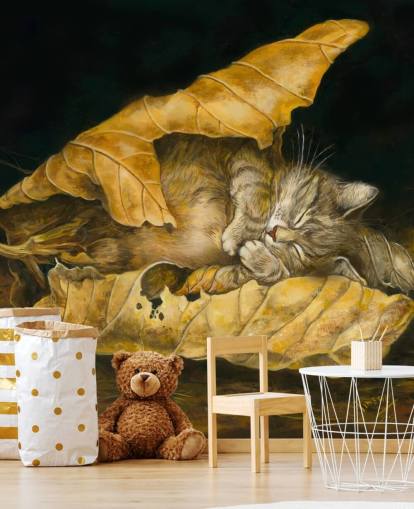 chaton endormi dans les feuilles d'automne