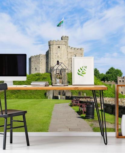 Cardiff Castle på en højen med walisisk Flag Baggrund