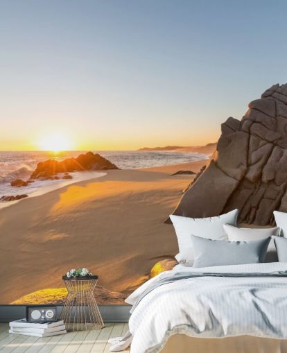 Fondo de pantalla de playa rocosa con un hermoso atardecer