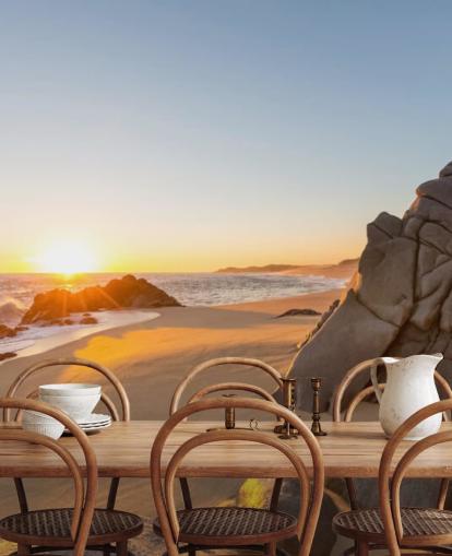 Fondo de pantalla de playa rocosa con un hermoso atardecer