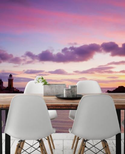 Roze zonsondergang bij kustmuurschildering