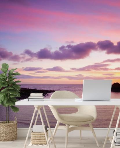 Roze zonsondergang bij kustmuurschildering