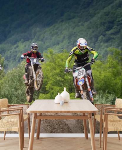 Fondo de pantalla de corredores de motocross que van sobre una colina