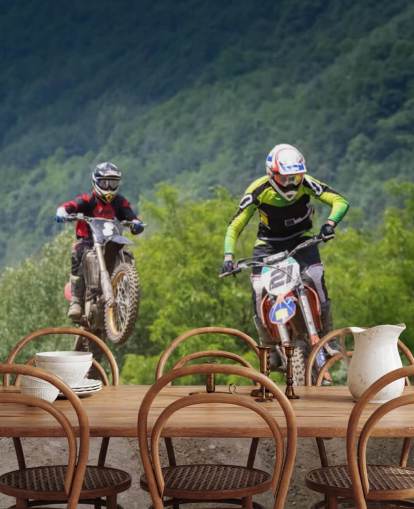 Fondo de pantalla de corredores de motocross que van sobre una colina