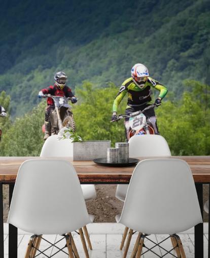 Motocross Racers Going Over a Hill Wallpaper