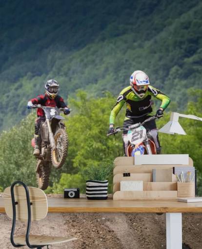 Motocross Racers Going Over a Hill Wallpaper
