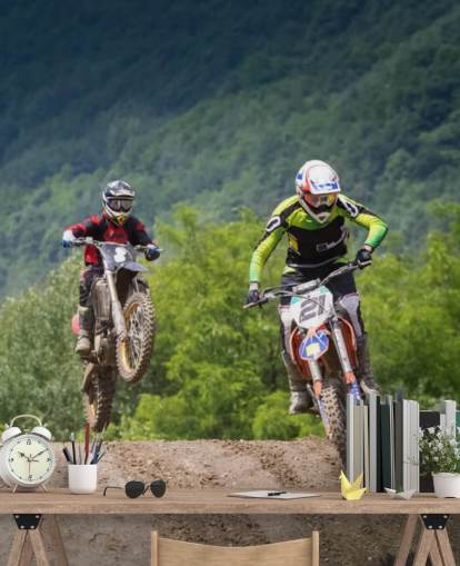 Fondo de pantalla de corredores de motocross que van sobre una colina