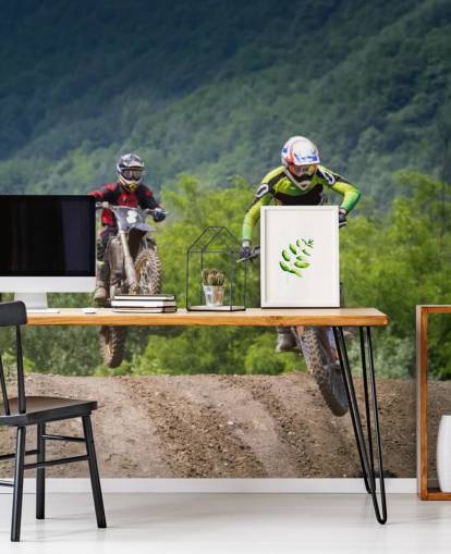 Motocross Racers Going Over a Hill Wallpaper