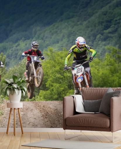 Motocross Racers Going Over a Hill Wallpaper