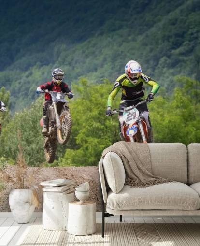 Motocross Racers Going Over a Hill Wallpaper