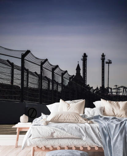 Lewis Hamilton Racing in Distance on Track Wallpaper