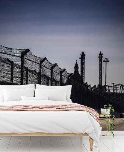 Lewis Hamilton Racing in Distance on Track Wallpaper