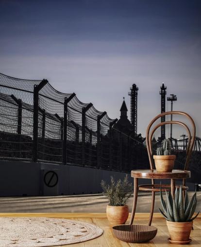 Lewis Hamilton Racing in Distance on Track Wallpaper