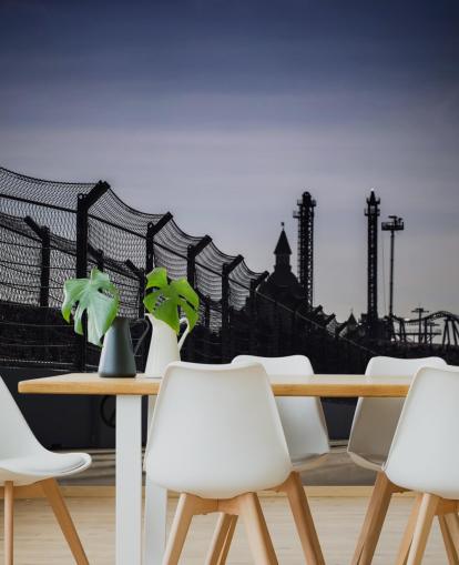 Lewis Hamilton Racing in Distance on Track fondo de pantalla