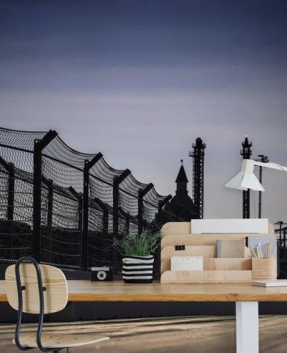 Lewis Hamilton Racing in Distance on Track Wallpaper