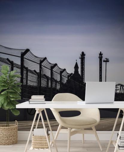 Lewis Hamilton Racing in Distance on Track Wallpaper