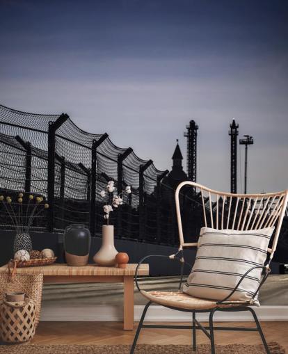 Lewis Hamilton Racing in Distance on Track Wallpaper