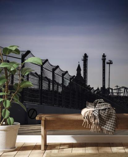 Lewis Hamilton Racing in Distance on Track Wallpaper