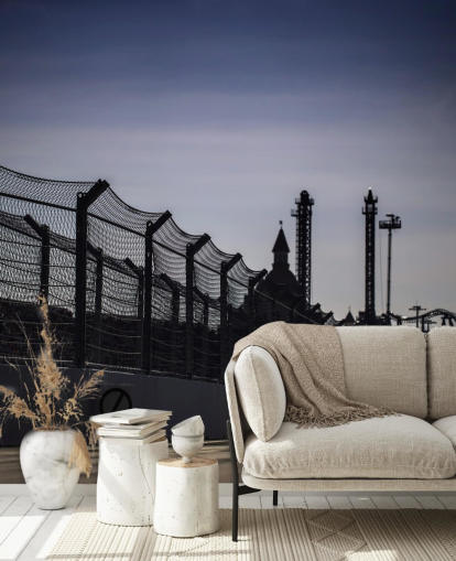 Lewis Hamilton Racing in Distance on Track Wallpaper