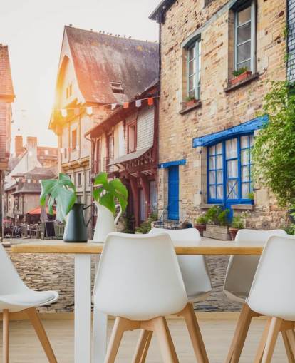 Charming street scene in an old town in Europe at sunset Wall Mural Wallpaper