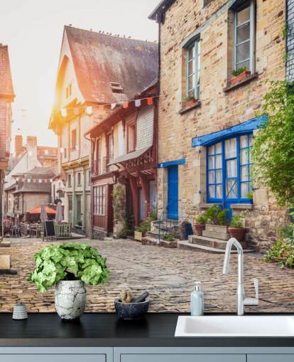 Charming street scene in an old town in Europe at sunset Wall Mural Wallpaper
