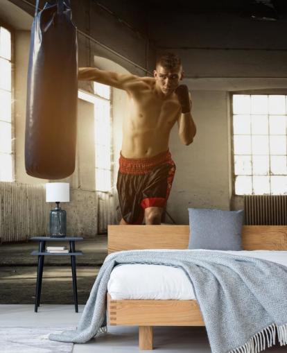 Young Man Boxing in Warehouse Wallpaper