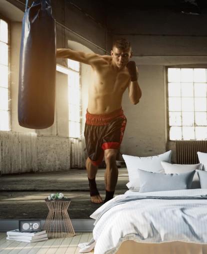 Fondo de pantalla de Young Man Boxing in Warehouse