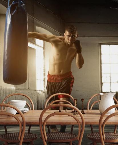 Young Man Boxing in Warehouse Wallpaper