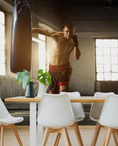 Young Man Boxing in Warehouse Wallpaper