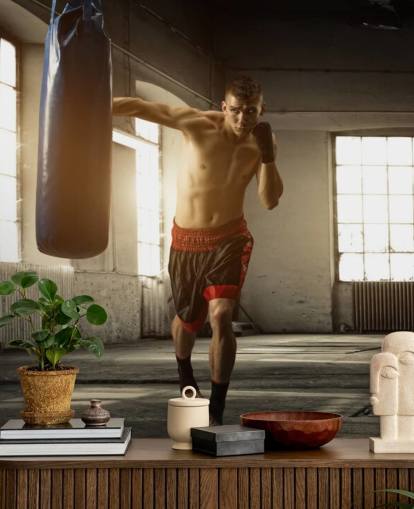 Young Man Boxing in Warehouse Wallpaper
