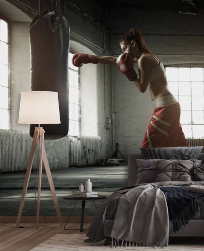 Young woman boxing workout in an old building wall mural