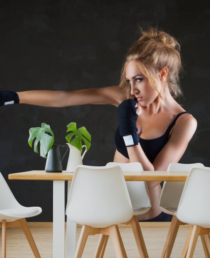 Sexy boxer woman making kick with boxing bandage mural